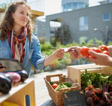 woman buying from market
