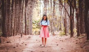 woman walking in trees
