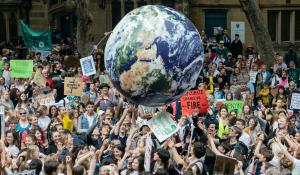 Image: climate protest. Text: COP 26 Progress, But Not Nearly Enough