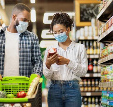 Image: couple in a supermarket. Topic: Don't Discount Our Future, Trader Joe's