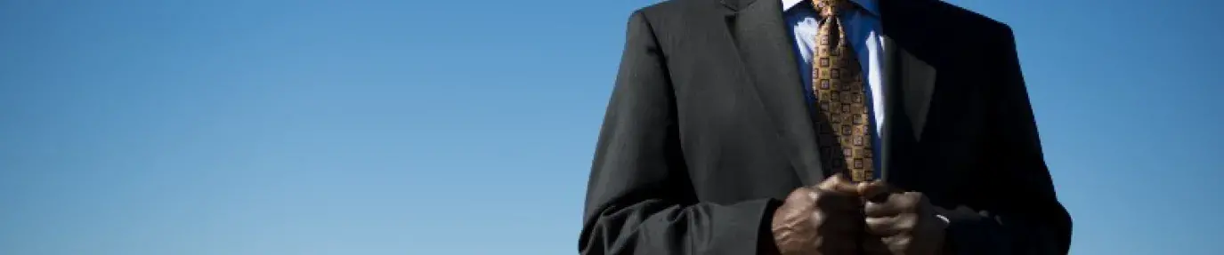 Image: Robert Bullard, black man standing in suit with blue sky in background. Topic: 8 Black Leaders Who've Revolutionized the Climate Movement