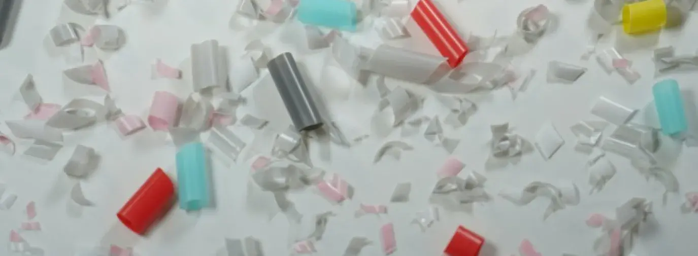 A close up shot of different colored straws that have been cut into smaller and smaller pieces.