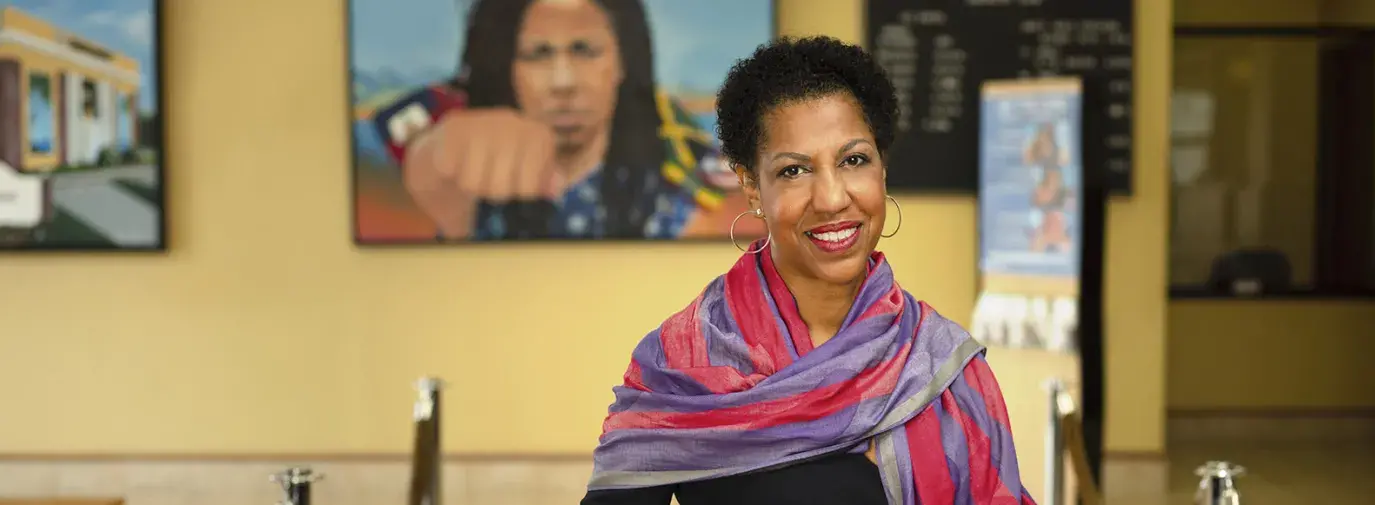 Teri Williams wearing a pink scarf